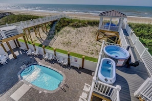 View of pool and 2 of 4 hot tubs