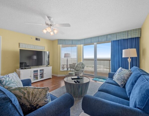 The ocean front living room is well-appointed with comfortable furnishings.