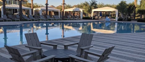 Beautiful resort style pool that is heated all year with cabanas and a kids pool