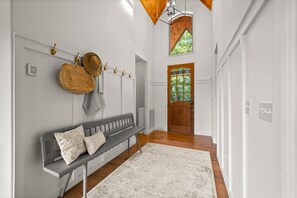 Gorgeous front entryway with cathedral ceiling that invites you into the open floorplan and breathtaking views