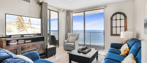 Living area with beach views, balcony access and sleeper-sofa