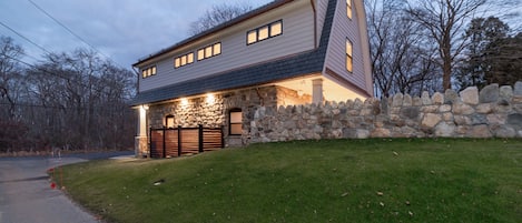 Side and back view, top of patio's 6-foot stone privacy wall