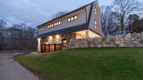 Side and back view, top of patio's 6-foot stone privacy wall