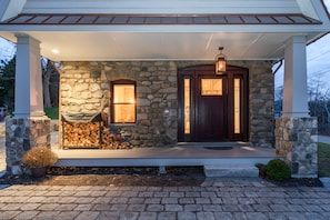 A Warm Welcome, in front of the home with Bevelo's hand-made copper gas Lantern