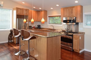Full kitchen with quartz countertops & island