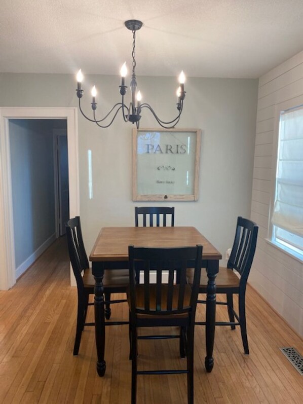 Bright and open dining room with brand new 4 top table.