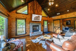 The living room has a smart TV and fireplace