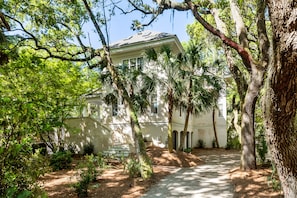 Front of House/ Pull in driveway/ 3 Garage Doors/ Parking spot in Front Right