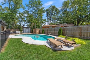 Large privacy fenced yard with pool and patio areas!