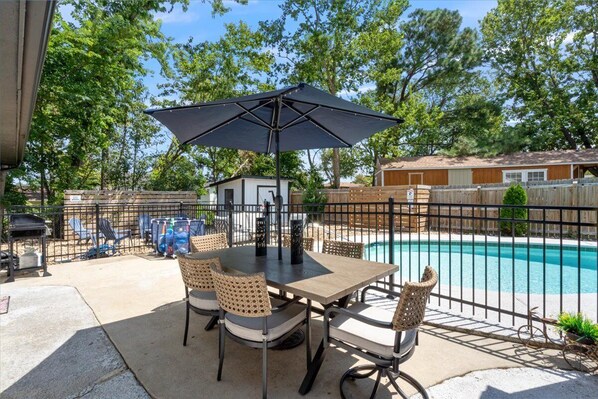 POOL! Large patio with dining area and covered seating area!