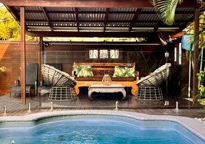 Relax in the Balinese cabana by your private heated pool.