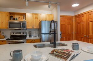 A well-equipped kitchen with all the basics for preparing meals or packing lunches for the day.