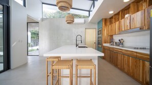 Spacious kitchen, luxury furnishings, and bar seating