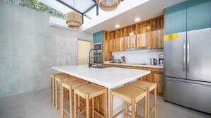 Spacious kitchen, luxury furnishings, and bar seating
