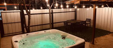 Kick back and relax in a warm Hot Tub with warm lighting!