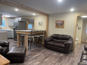 Living room and dining area looking into kitchen