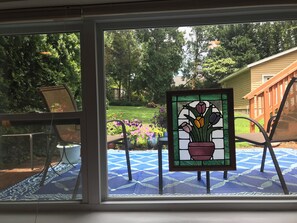 Huge picture window looking over patio and large backyard.