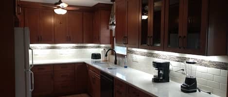 Large kitchen with under cabinet lighting and lots of counterspace