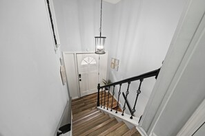 As you enter through the front door, taking the stairs up leads to the kitchen