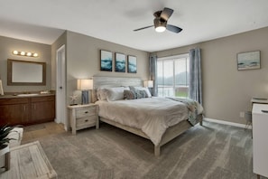 Primary suite has it all!  King Bed! Night stand lamps have USB outlets, Room darkening curtains, a Roku TV and a dedicated desk workspace, enjoy!
