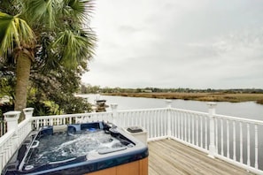 Relax in the Hot Tub overlooking the RIver