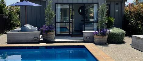 Looking across the pool from the main house to the cottage.