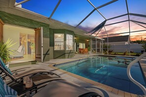 Relax poolside into the night hours.