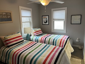 First floor bedroom with twin beds. Full attached bath. 