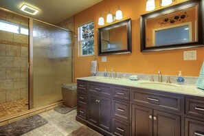The upgraded master bathroom has double vanity and a large walk in shower with 2 separate showers lends plenty of space for 2 or even 3 to get ready at the same time.  