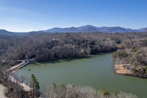 Upper drone view of the private lake (Mirror Lake) where the cabin is located