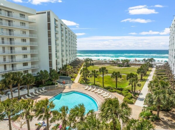 The south pool has a hot tub and is located next to the beach