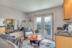 Enjoy the open-concept design, creating a smooth flow between cooking, lounging, and sleeping areas (TV recently added in this room).
