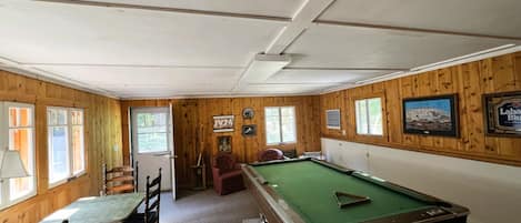 Game room with pool table. - Game room with pool table.