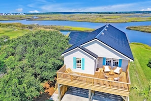 Sweeping sound views in back.  Front deck has sunrise views & cool ocean breezes