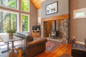 View of inglenook fireplace in great room. 