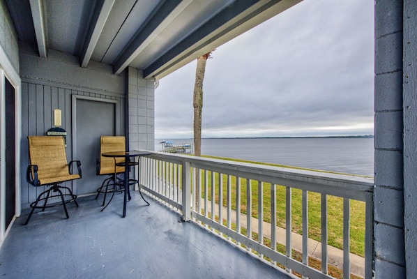 Wrap around balcony, facing Ochlockonee Bay, with table and 2 chairs