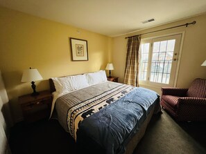 New king bed with all new bedding from the quilt down to the bed frame