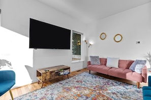 Living Room with 65-inch TV with Premium Cable pkg.