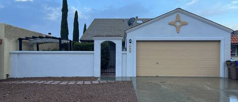 Front of the home! Pergola, private driveway. One car inside the garage allowed 