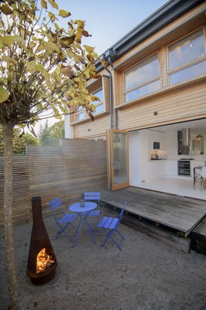 View from rear garden looking at fold back doors to dining kitchen area 