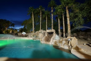 Water slide and lotsof jumping rocks on this 60k gal pool