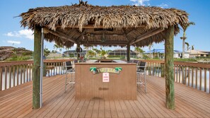 Tiki bar seating for six people.