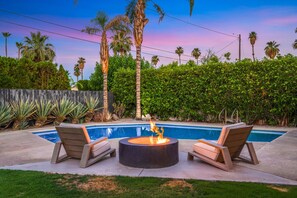 Enjoy the ambiance of the fire pit by the pool