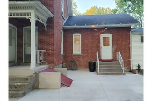 Entrance to thehouse on the right.  Park in driveway further to the right
