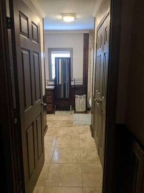 guest bath entrance - flanked on each side by closets