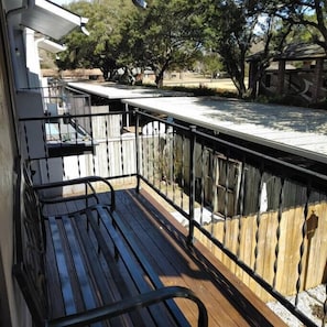 Master balcony - facing away from river & overlooking covered parking (2 spots)