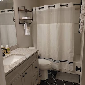 Full bathroom with tub/shower combo