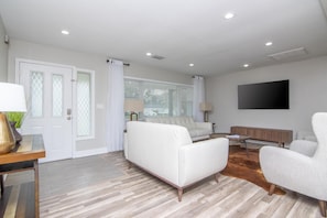 Living Room Area w/ 65in Smart TV