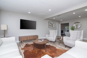 Living Room Area w/ 65in Smart TV