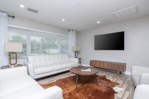 Living Room Area w/ 65in Smart TV
